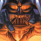 Darth Vader reaches towards an unseen target while being lit from underneath.